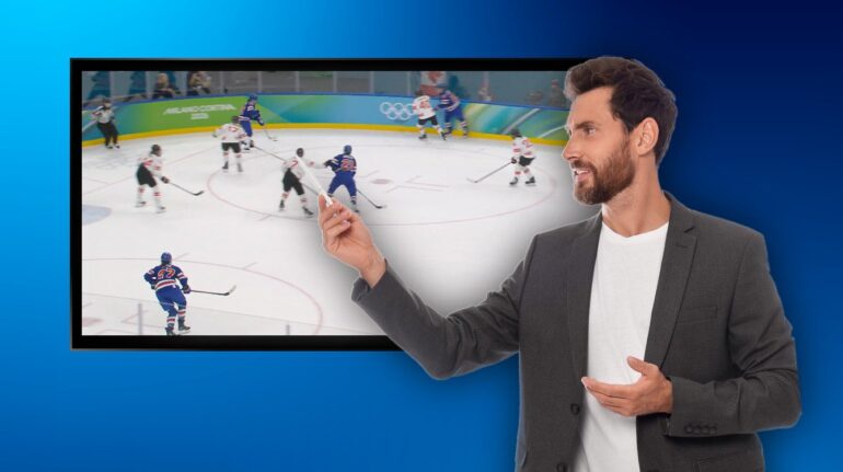 IJshockey voor normaalzienden krijgt iemand in beeld die aanwijst waar de puck is